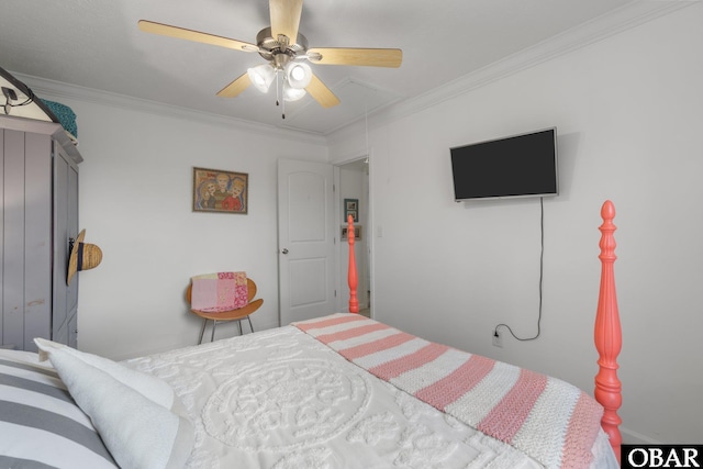 bedroom featuring attic access, ceiling fan, and crown molding
