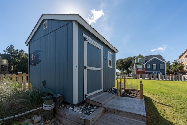 view of shed featuring fence