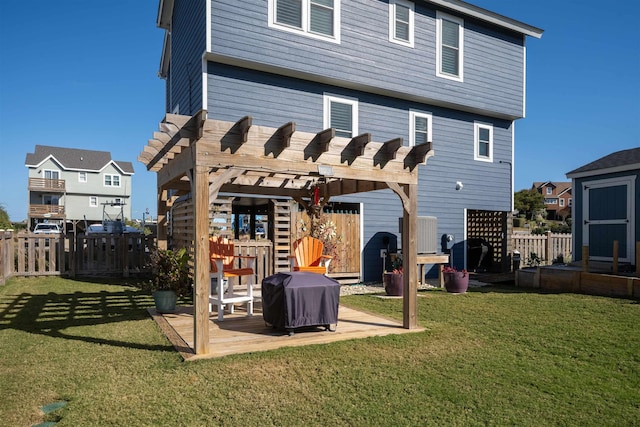 rear view of property with a fenced backyard, a lawn, a pergola, and a patio