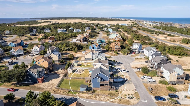 drone / aerial view featuring a water view and a residential view