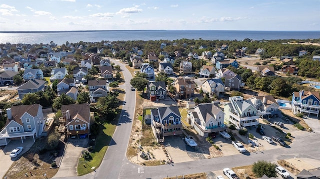 drone / aerial view featuring a water view and a residential view