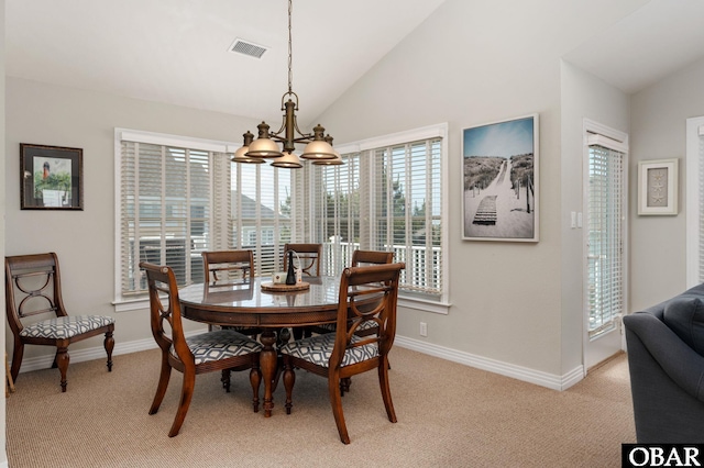 747 Hammock Ln Lot 55, Corolla, NC 27927 - dining area featuring lofted ceiling, a chandelier, and light colored carpet