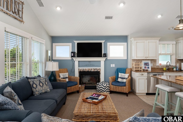 747 Hammock Ln Lot 55, Corolla, NC 27927 - living room with lofted ceiling, a fireplace with flush hearth, and recessed lighting