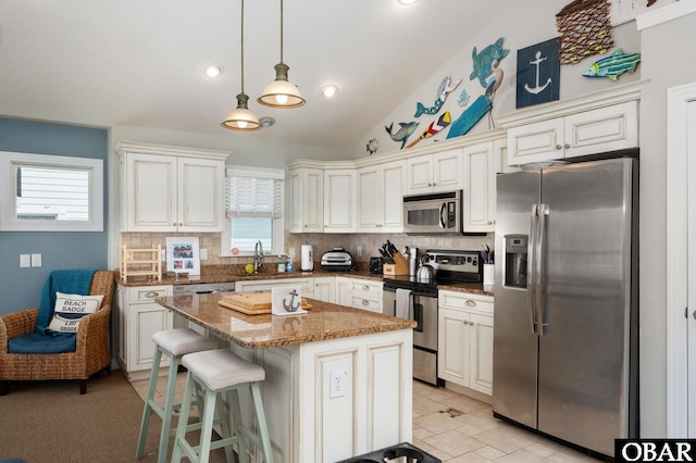 747 Hammock Ln Lot 55, Corolla, NC 27927 - kitchen with stainless steel appliances, backsplash, a kitchen island, dark stone countertops, and pendant lighting