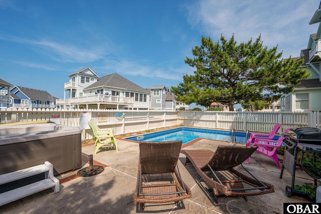 747 Hammock Ln Lot 55, Corolla, NC 27927 - view of pool featuring a hot tub, a patio area, a fenced backyard, and a residential view