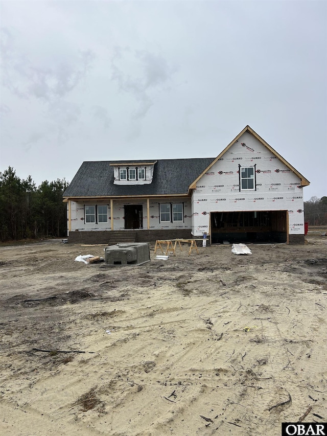 property under construction with a garage and cooling unit