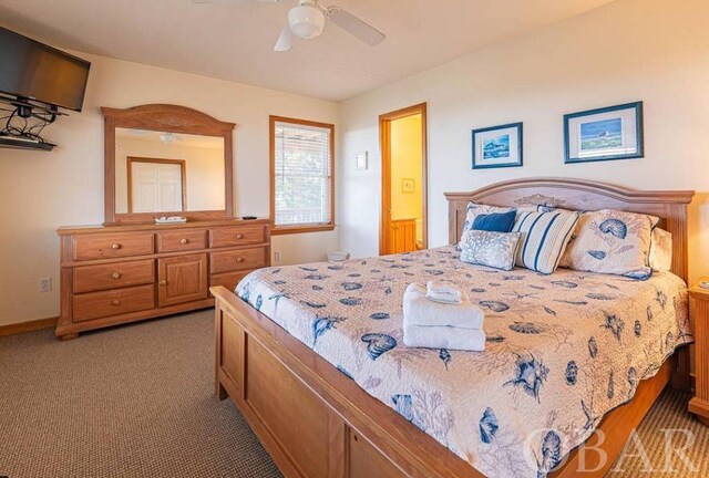 bedroom featuring light carpet, ceiling fan, and baseboards