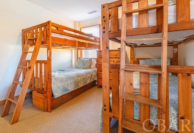 carpeted bedroom with visible vents