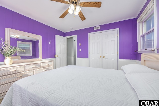 bedroom featuring a ceiling fan, a closet, and visible vents