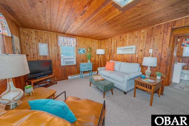 105 Rocky Mount St Lot 399, Kill Devil Hills, NC 27949 - living room featuring a baseboard heating unit, wood ceiling, carpet floors, plenty of natural light, and wooden walls