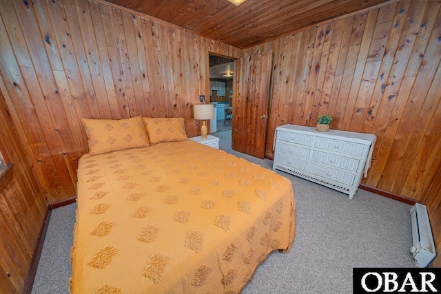 105 Rocky Mount St Lot 399, Kill Devil Hills, NC 27949 - bedroom with carpet, wooden walls, wooden ceiling, and a baseboard radiator