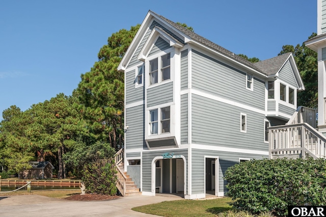 view of property exterior featuring stairs