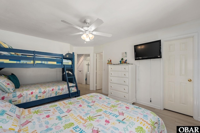 bedroom with ceiling fan and light wood finished floors