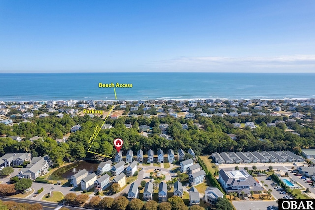 birds eye view of property featuring a water view and a residential view