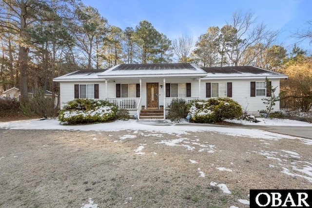 ranch-style home featuring covered porch