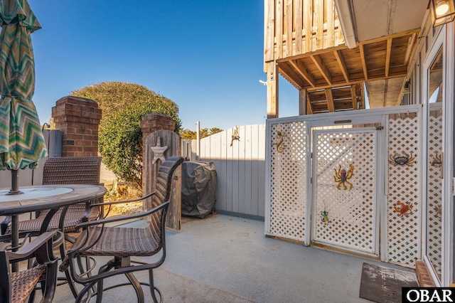 view of patio / terrace with outdoor dining area and fence