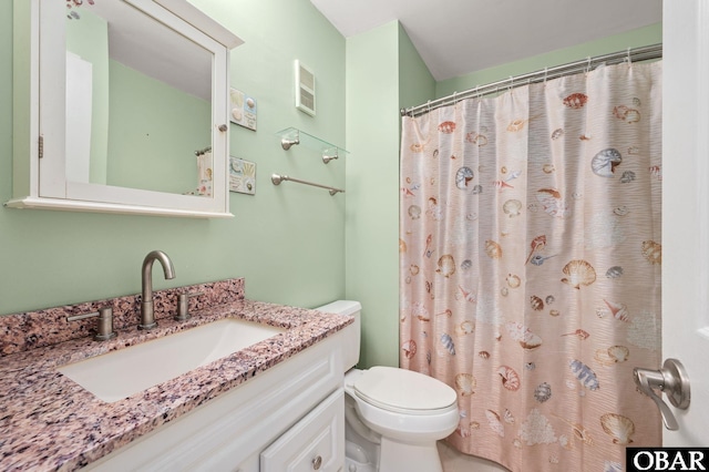 bathroom with toilet, visible vents, and vanity