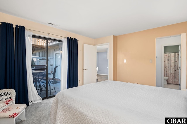 carpeted bedroom featuring access to exterior and visible vents