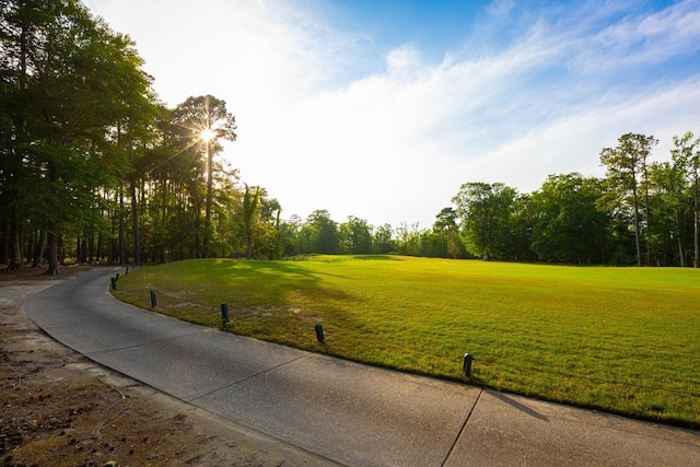 view of home's community featuring a lawn