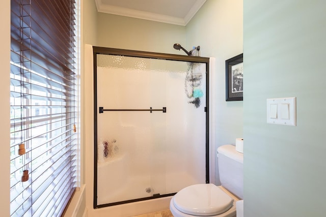 full bath with a shower stall, toilet, and crown molding