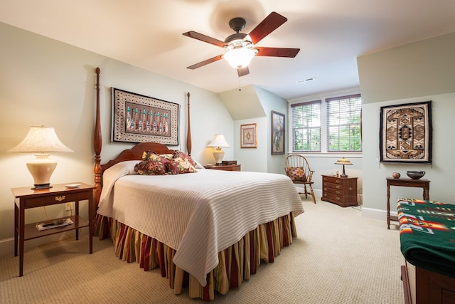 bedroom featuring visible vents, a ceiling fan, baseboards, and light carpet