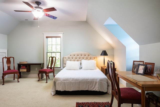 carpeted bedroom with visible vents, a ceiling fan, and vaulted ceiling