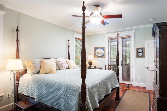 bedroom featuring access to exterior, crown molding, baseboards, wood finished floors, and a ceiling fan