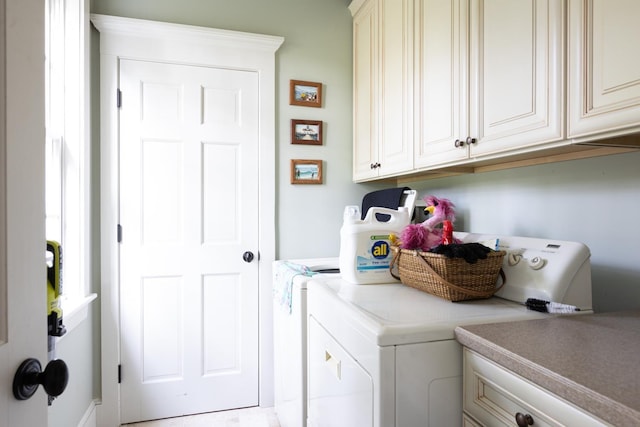 laundry area featuring cabinet space and washing machine and dryer