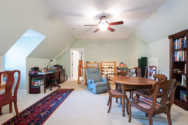 dining area with visible vents, lofted ceiling, light colored carpet, and a ceiling fan