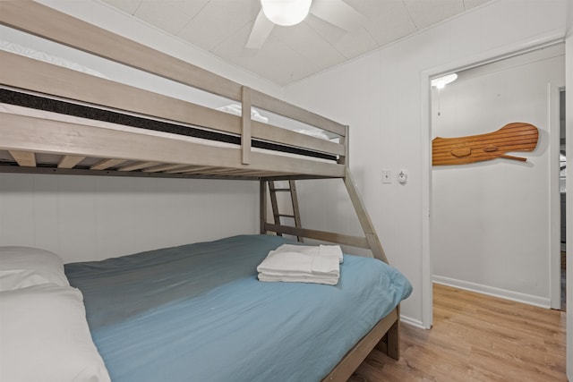 bedroom featuring light wood-type flooring and a ceiling fan