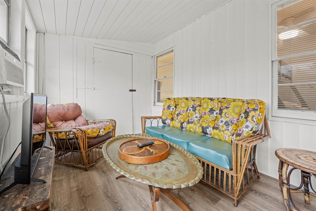 sitting room with wood finished floors and wood ceiling