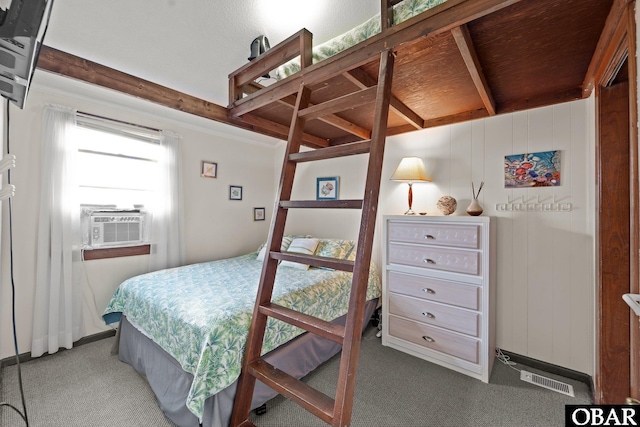 1400 N Virginia Dare Trl, Kill Devil Hills, NC 27948 - carpeted bedroom with cooling unit and beamed ceiling