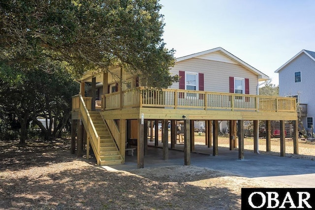 view of play area with stairway and a wooden deck