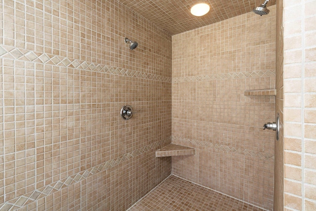 full bath featuring a tile shower