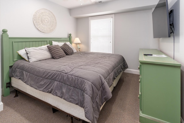 carpeted bedroom with baseboards and visible vents