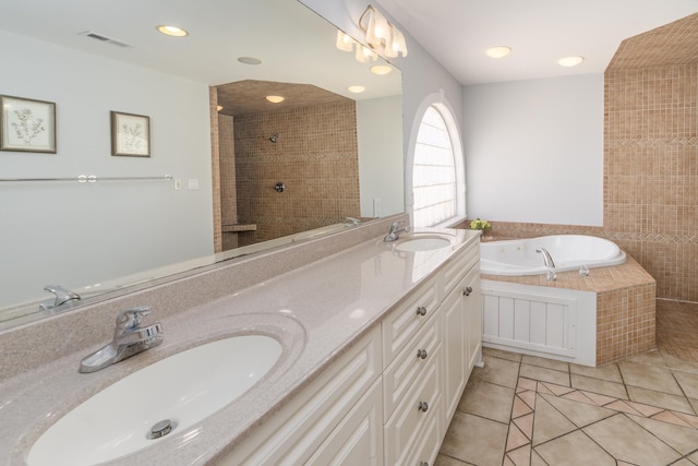 full bath featuring tile patterned flooring, visible vents, double vanity, and a sink