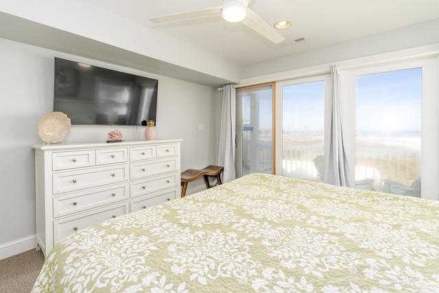 carpeted bedroom featuring access to exterior, visible vents, ceiling fan, and baseboards