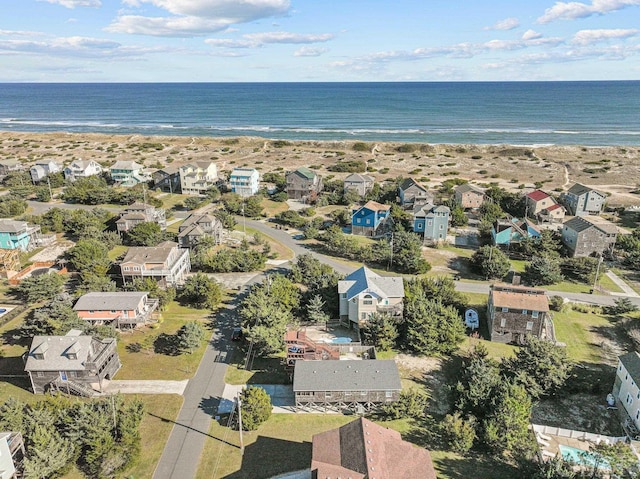 birds eye view of property featuring a water view and a residential view