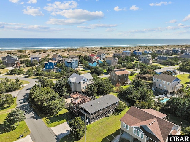 drone / aerial view with a water view and a residential view