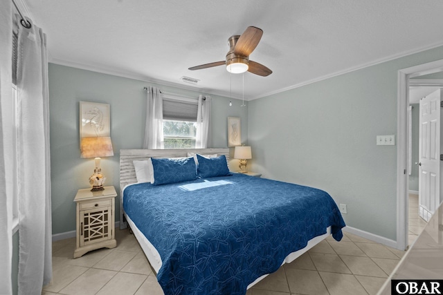 bedroom with light tile patterned floors, baseboards, visible vents, and crown molding