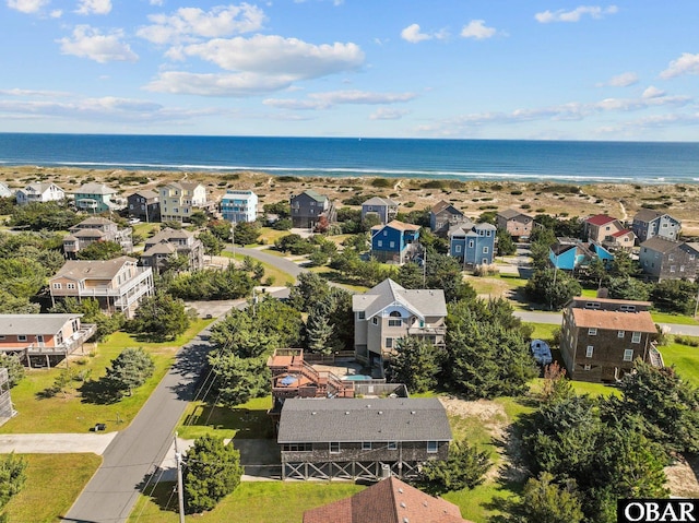 birds eye view of property featuring a water view and a residential view