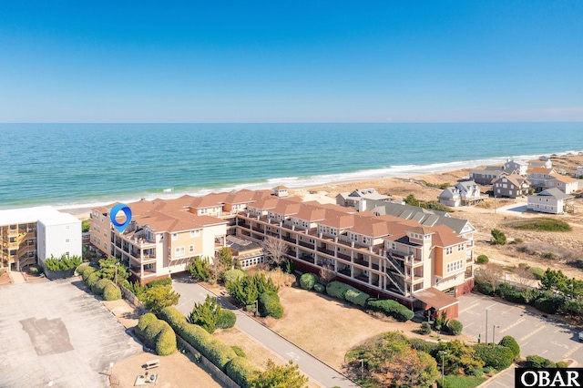 aerial view featuring a water view and a beach view