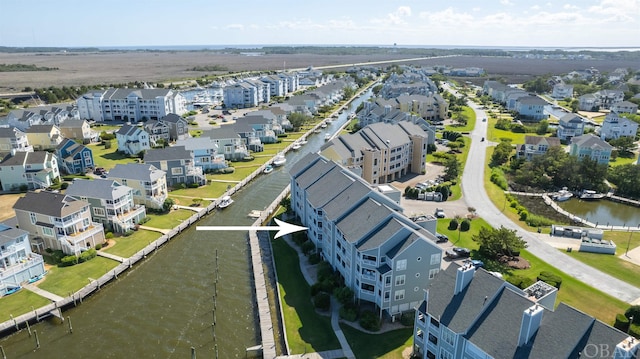 bird's eye view with a water view and a residential view