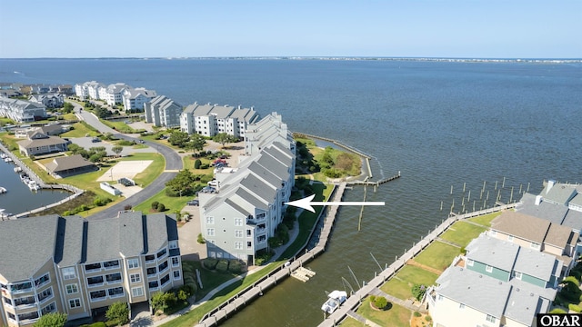 birds eye view of property featuring a residential view and a water view