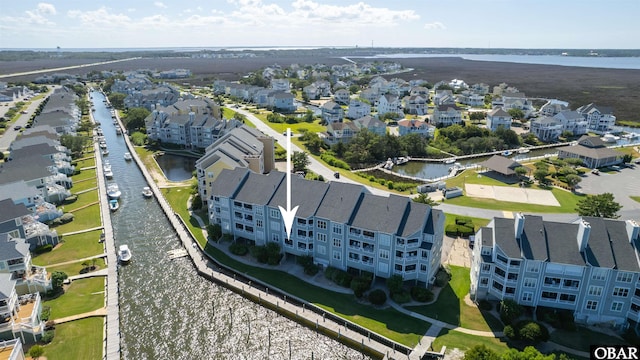 bird's eye view with a residential view and a water view