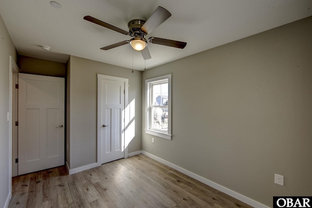 27248 Sand St Lot # 6, Salvo, NC 27972 - unfurnished bedroom featuring light wood-type flooring, a closet, and ceiling fan