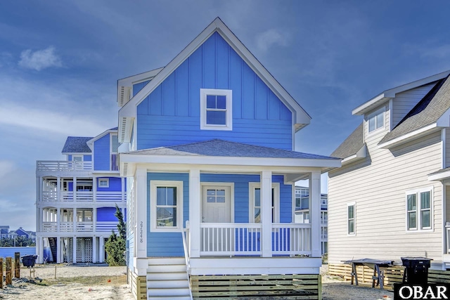 27248 Sand St Lot # 6, Salvo, NC 27972 - view of front facade with board and batten siding, a porch, and roof with shingles