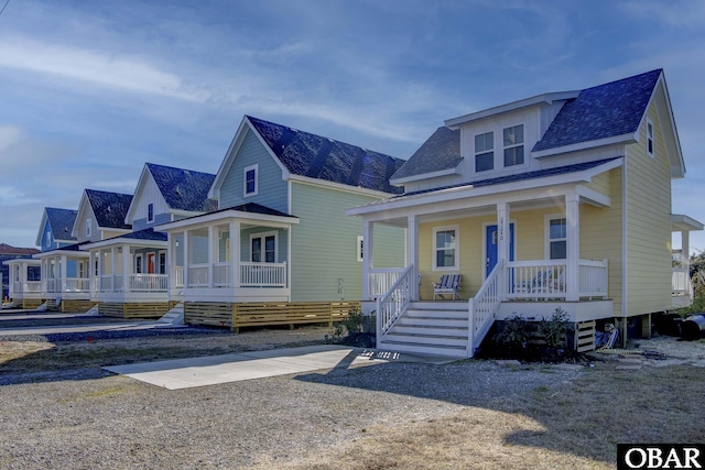27248 Sand St Lot # 6, Salvo, NC 27972 - bungalow-style house featuring covered porch, roof with shingles, and stairs