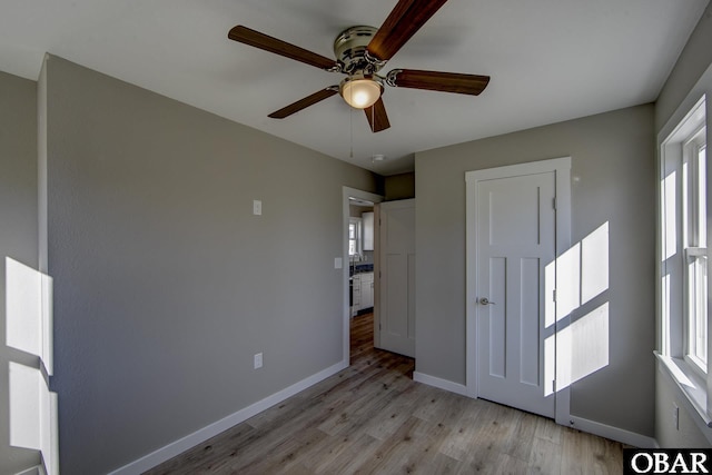 27248 Sand St Lot # 6, Salvo, NC 27972 - unfurnished bedroom featuring light wood-style floors and a ceiling fan