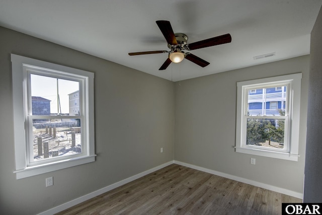 27248 Sand St Lot # 6, Salvo, NC 27972 - empty room featuring wood finished floors and ceiling fan